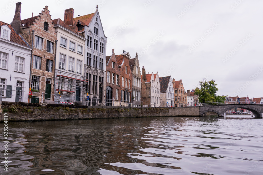 Beautiful medieval city of Bruges in Belgium (Europe). Full of bridges and water channels, surrounded by fantastic buildings.