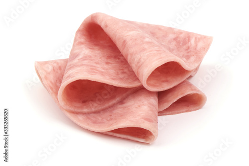 Thin salami sausage slices, isolated on white background