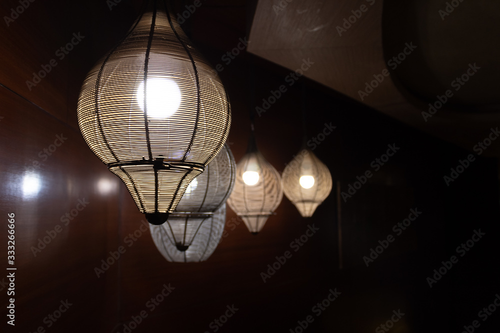 Beautiful ceiling lights hanging down from the roof in romantic concept.