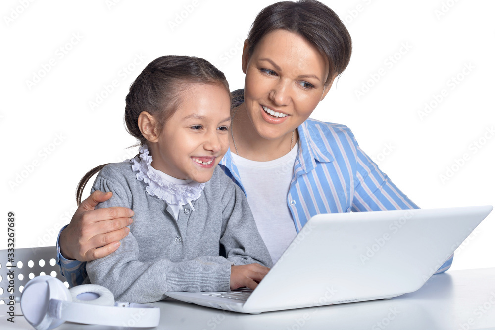 Portrait of emotional mother and daughter using laptop Portrait of emotional mother and daughter using laptop