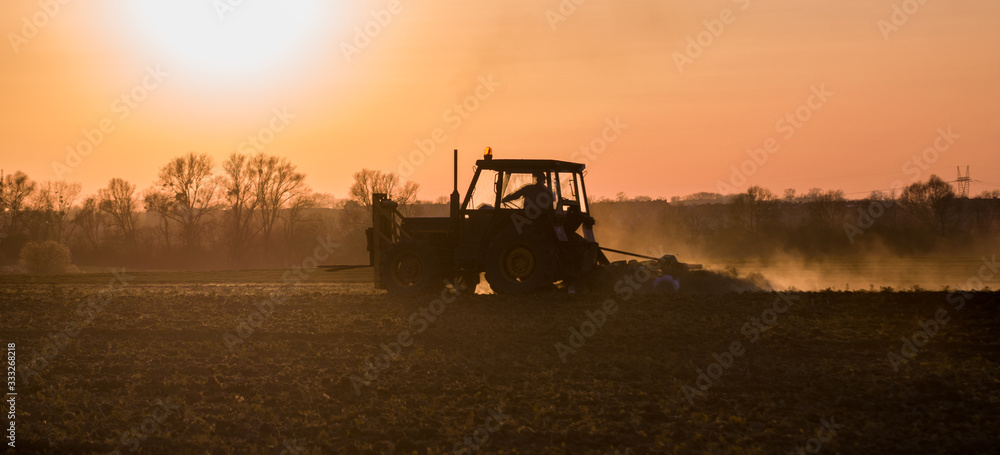 Fototapeta premium tractor plowing the field