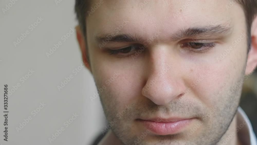 Eyes of serious caucasian man using his tablet computer. Screen reflecting in the eyes, device lighting glow. 4K extreme close up video. Eyes of serious caucasian man using his tablet computer. Screen reflecting in the eyes, device lighting glow. 4K extreme close up video.