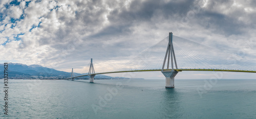 Aerial view of long cable-stayed Rio bridge in Greece at clouds weather, Ferry station photo