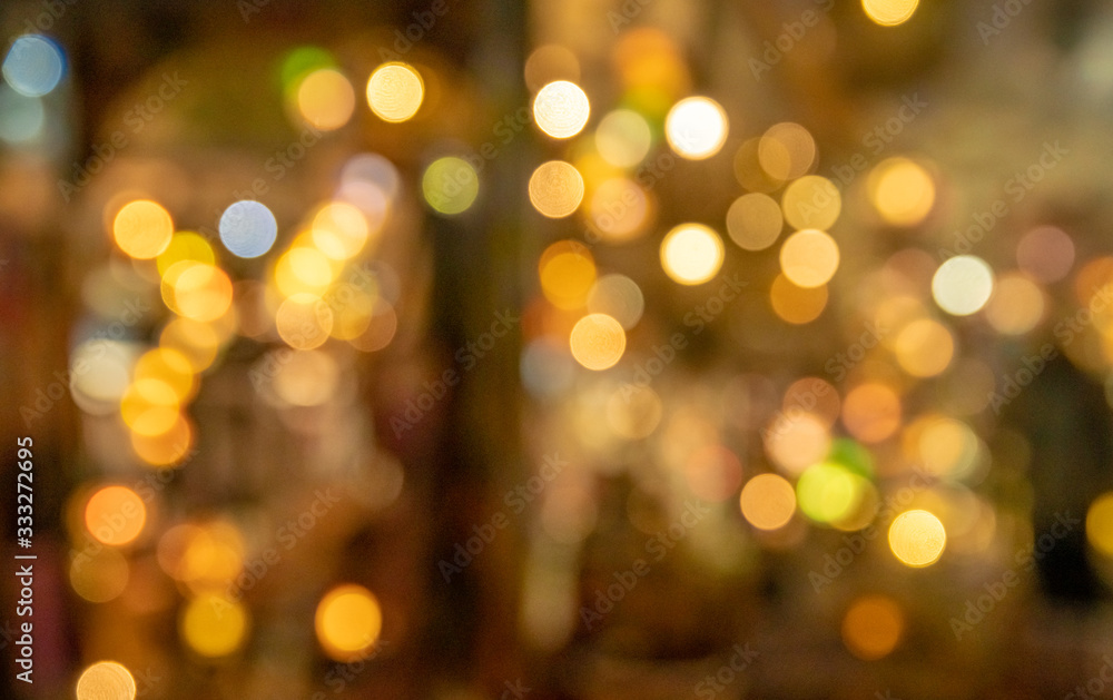 Colorful bokeh with yellow tint as blurry background