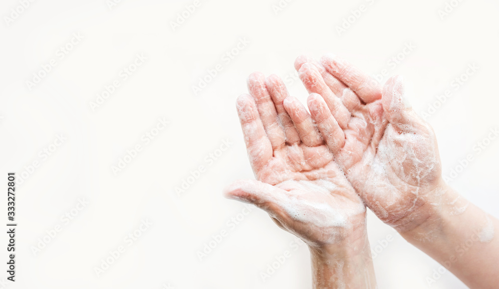Fototapeta premium The baby's soap hands on a light background.Clean hand concept idea.