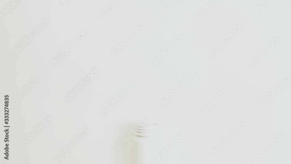 vitamin pills and citrus moving in bottle on white background. Stop motion vitamin pills and citrus moving in bottle on white background. Stop motion