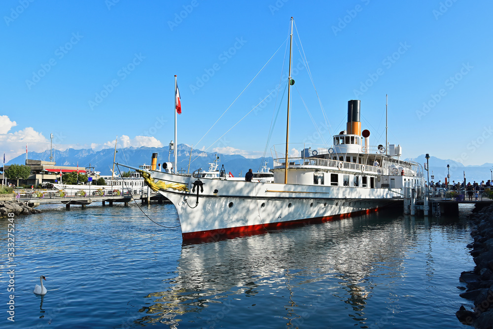 Lausanne, Switzerland - August 24, 2019. Ouchy port on Geneva Lake in Lausanne, Switzerland. Lausanne, Switzerland - August 24, 2019. Ouchy port on Geneva Lake in Lausanne, Switzerland.