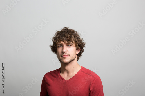 Studio portrait of a confident young man