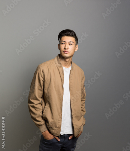 Studio portrait of a confident young man