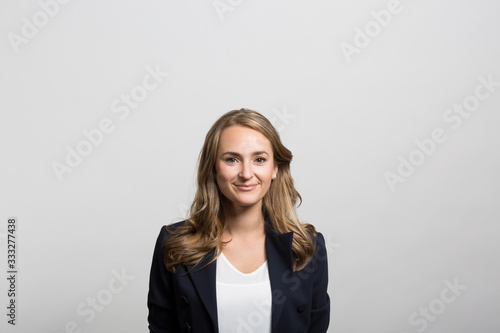Valokuva studio portrait of a happy businesswoman