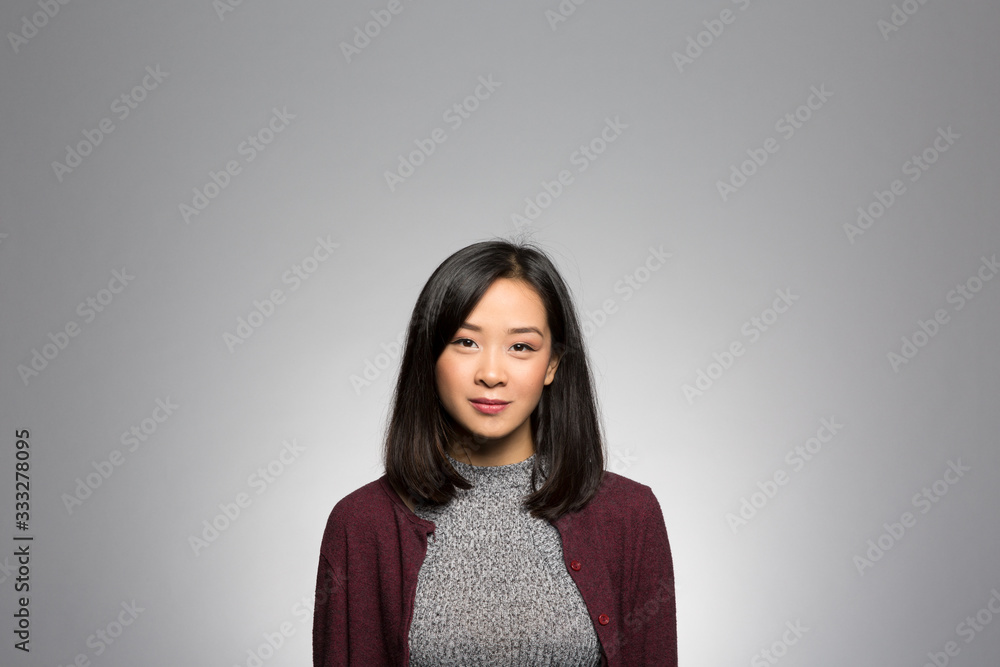 Fototapeta premium Studio portrait of a thoughtful young woman
