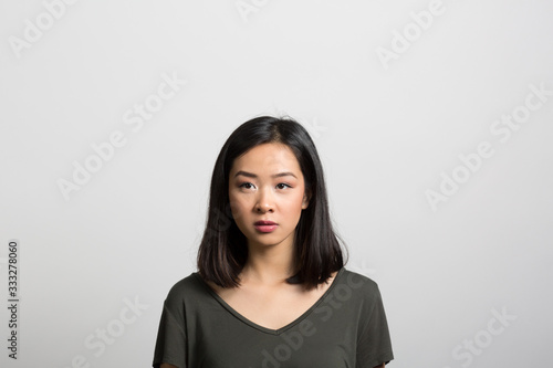 Studio portrait of a young woman contemplating