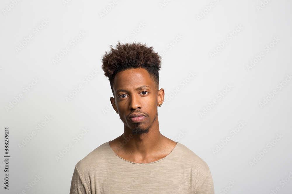 Obraz premium Studio portrait of a pensive young man 