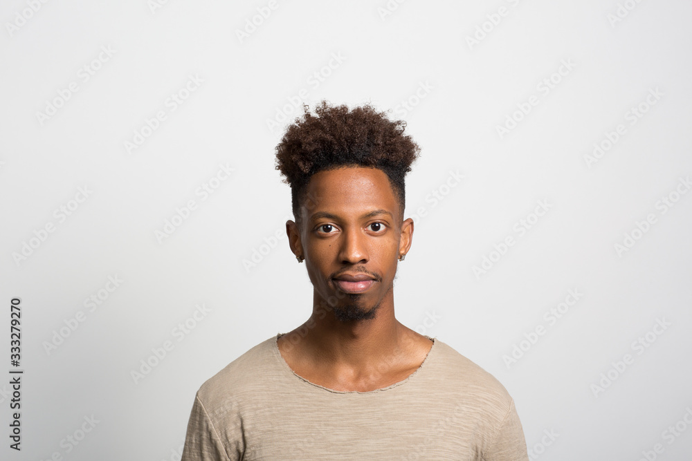Obraz premium Studio portrait of a pensive young man 