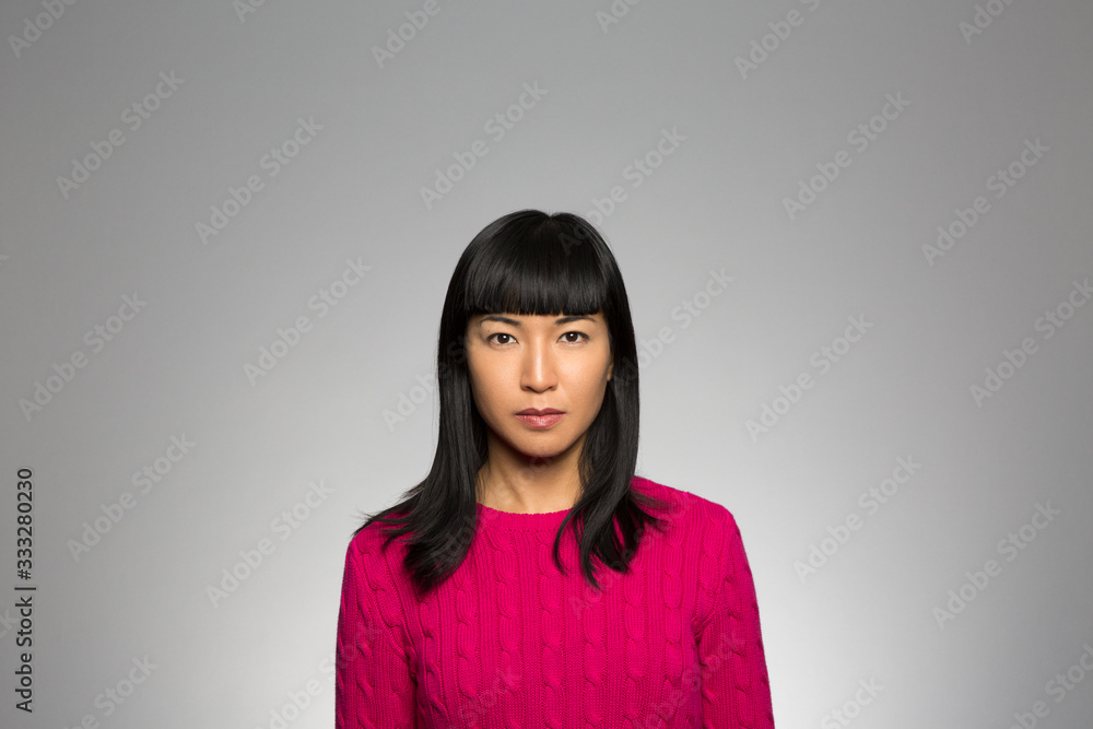 Fototapeta premium Studio portrait of a pensive woman 