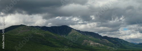 Mountains of Lake Baikal, Siberia. Panoramic landscape of the wild forest. Overcast.