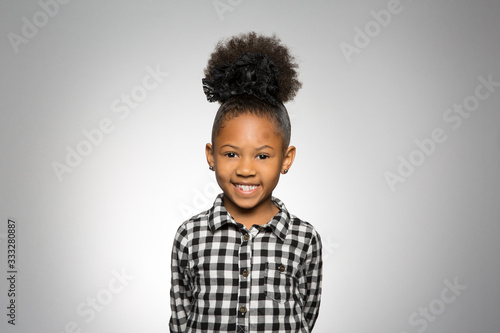 studio portrait of a happy girl
