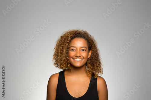 studio portrait of an excited young woman 