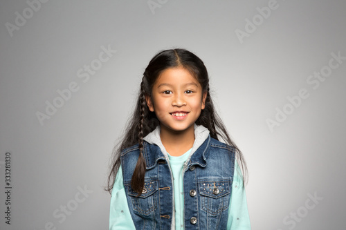 studio portrait of a happy girl