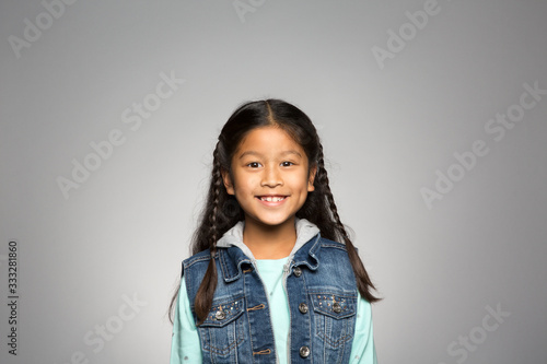 studio portrait of a happy girl