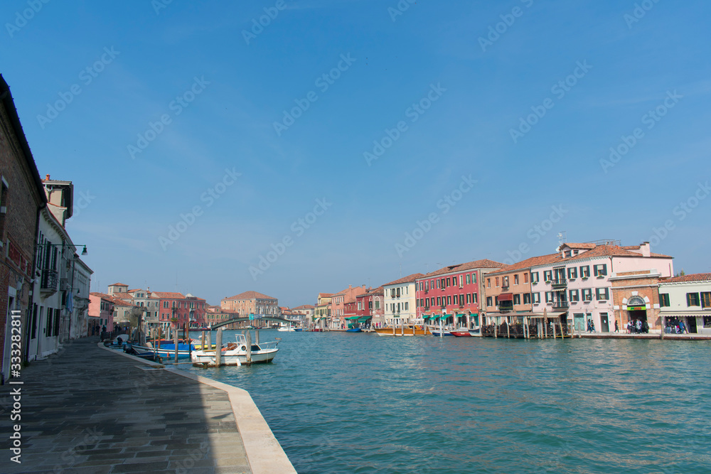 Murano / Venice / Italy - April 17, 2019: View of Murano big canal, Ponte Longo and old buildings