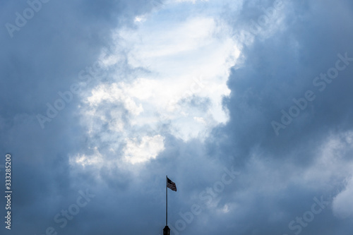 US Flag over San Antonio during storm