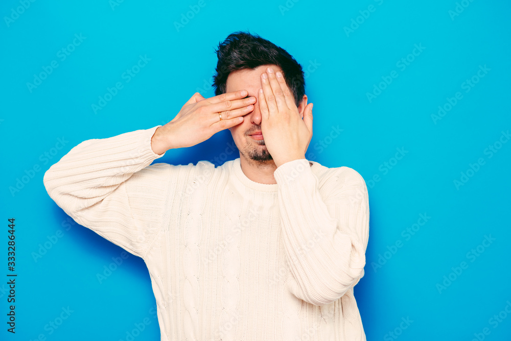 Man closes eyes with her hands Man closes eyes with her hands