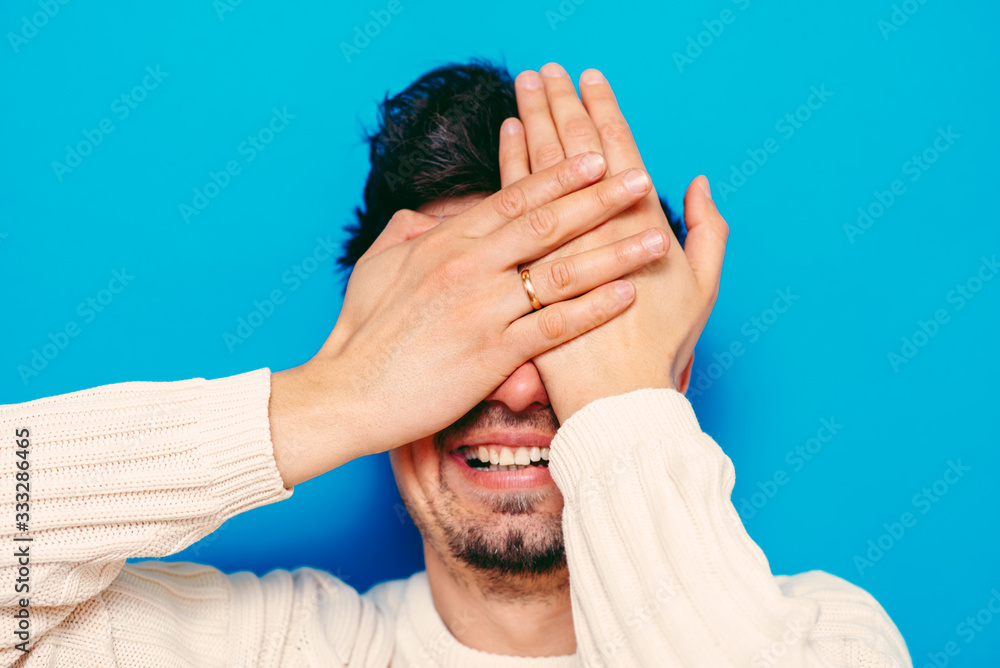 Fototapeta premium Man closes eyes with her hands