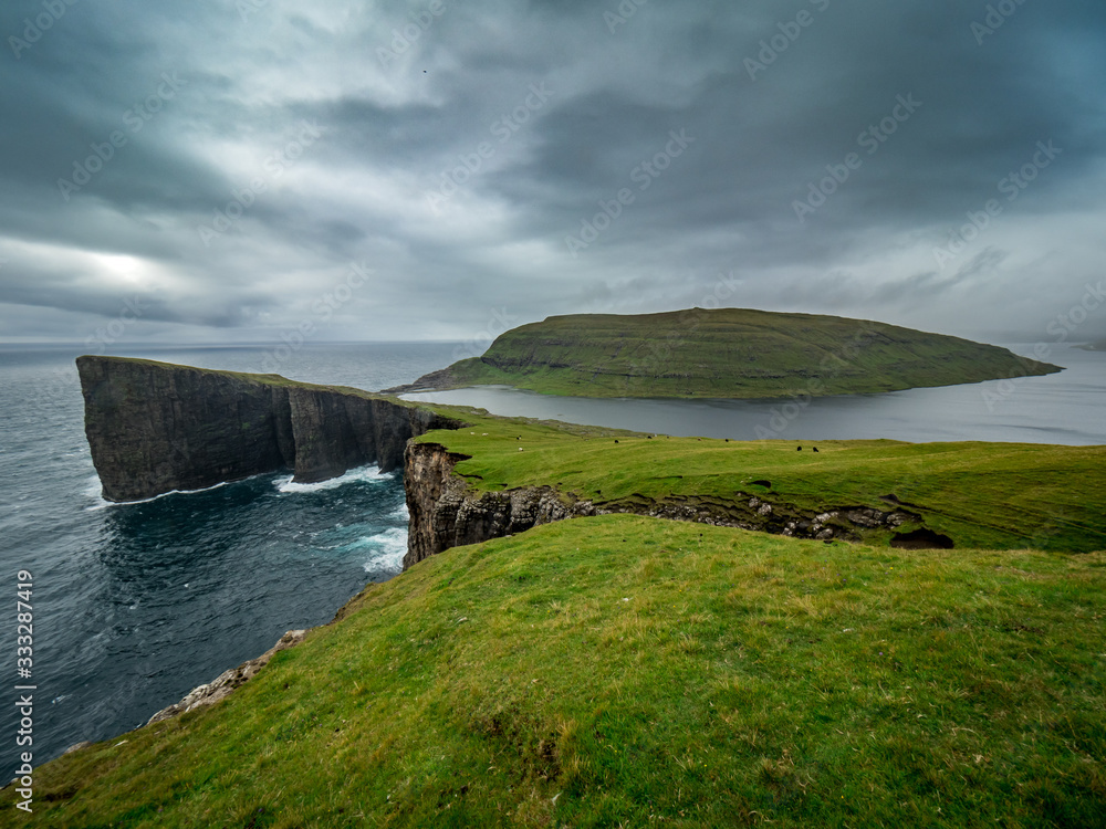 Faroe Islands, Trælanípan or Slave Cliffs. Famous spot with a view for the lake above the sea level.