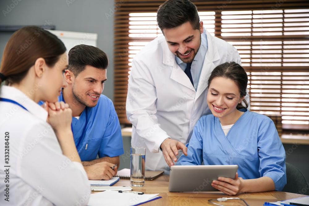 Team of professional doctors having meeting in office Team of professional doctors having meeting in office