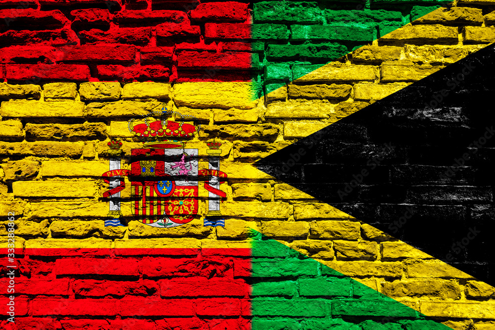 Flag of Spain and Jamaica on brick wall