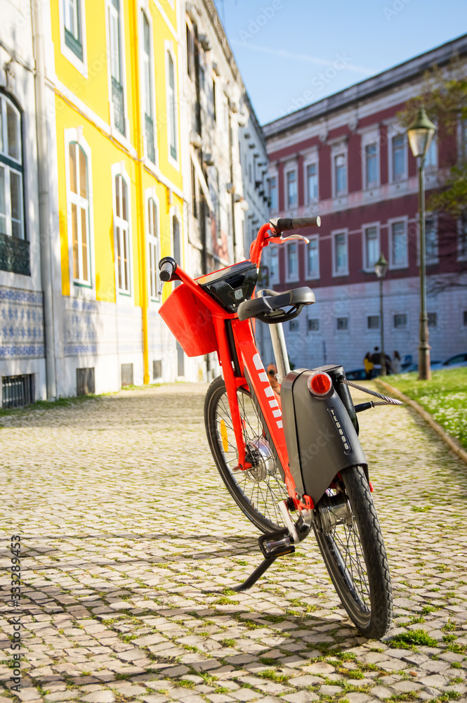 Red electric bike on the sunny street