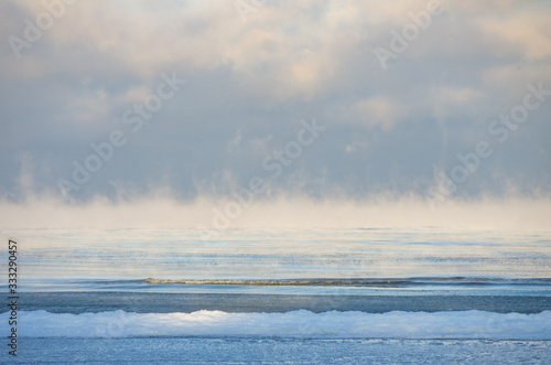 Sea smoke in winter. The Baltic Sea on a cold Janusry morning in Latvia. Steam fog.