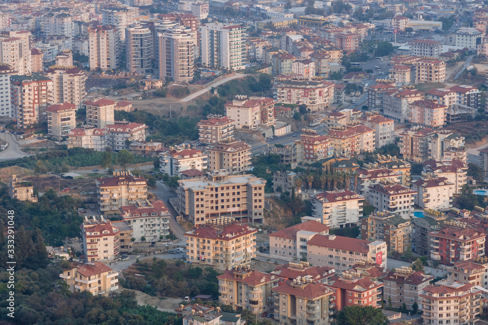Alanya. Turkey. View of the residential neighborhoods popular resort town on the Anatolian coast. Dusk. Bird's-eye view.