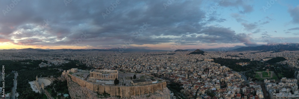 Aerial view of Acropolis of Athens, the Temple of Athena Nike, Parthenon, Hekatompedon Temple, Sanctuary of Zeus Polieus, Odeon of Herodes Atticus, Erechtheion at sunset