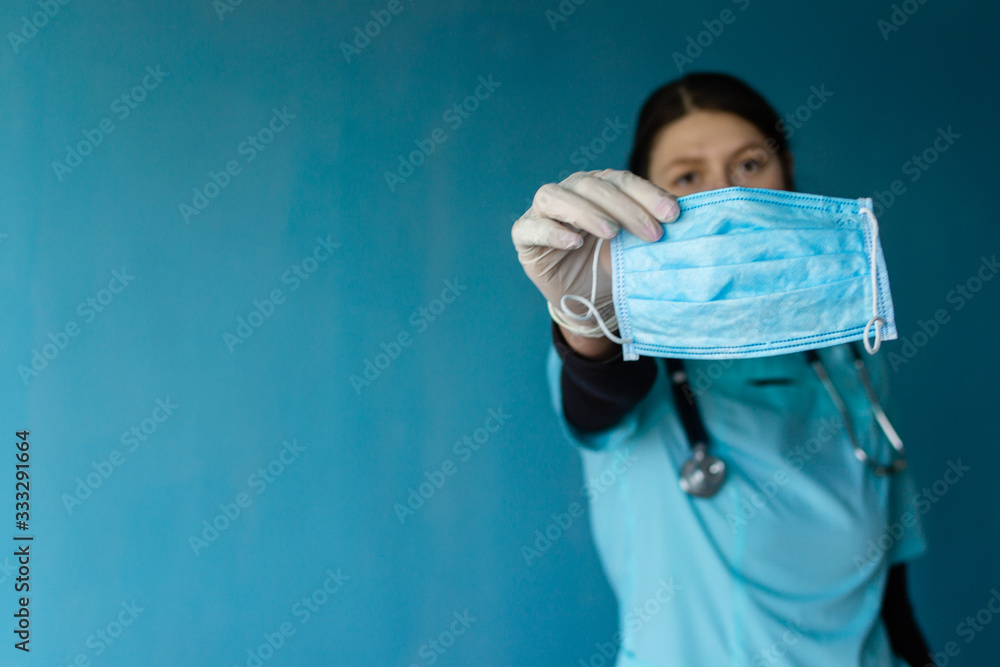 COVID-19 Pandemic Coronavirus. A doctor with a paper with keep calm and stay at home holding on hand, protect from Coronavirus or Covid-19 epidemic COVID-19 Pandemic Coronavirus. A doctor with a paper with keep calm and stay at home holding on hand, protect from Coronavirus or Covid-19 epidemic
