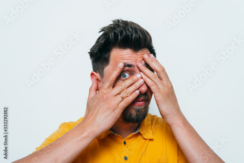 Man closes eyes with her hands