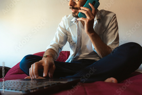 young freelancer working at home typing on a computer