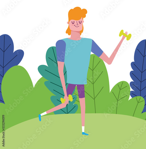 young man with weight dumbbell outdoor healthy life