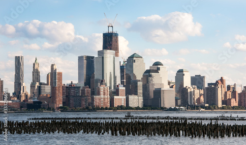 New York Skyline with Freedom Tower under construction and pilings in the river.