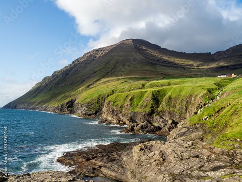 Faroe Islands, Viðoy, Viðareiði, cliffs below the town and ocean.