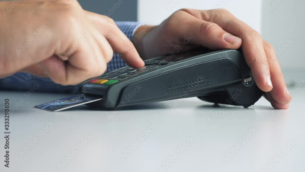 Payment by credit card, purchase and sale of goods and services. Credit card in the store. man pays the card reader online shopping concept lifestyle Payment by credit card, purchase and sale of goods and services. Credit card in the store. man pays the card reader online shopping concept lifestyle
