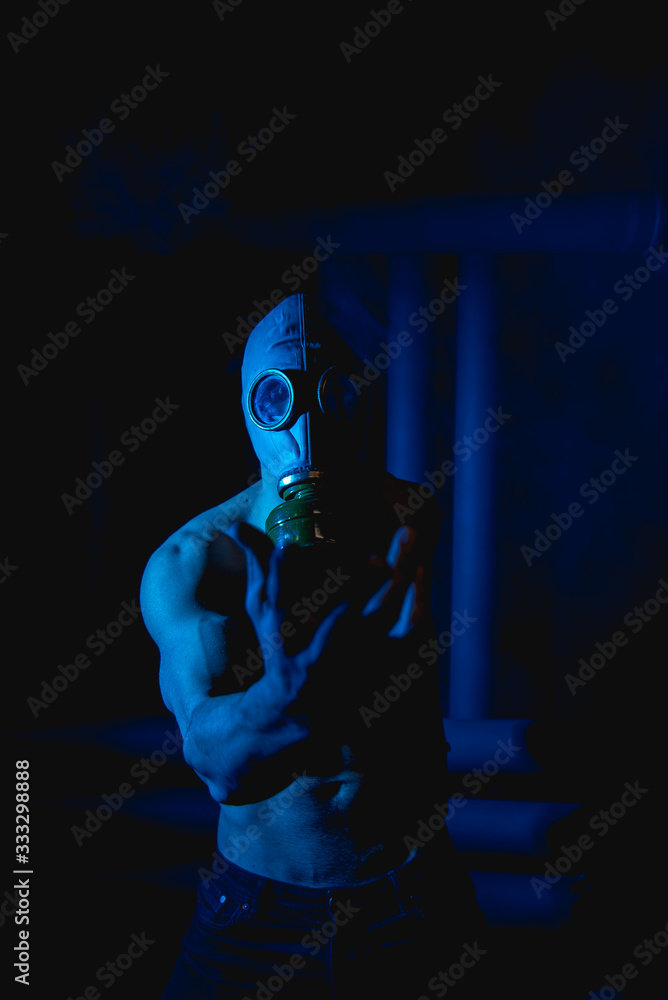 man in gas mask with outstretched hand