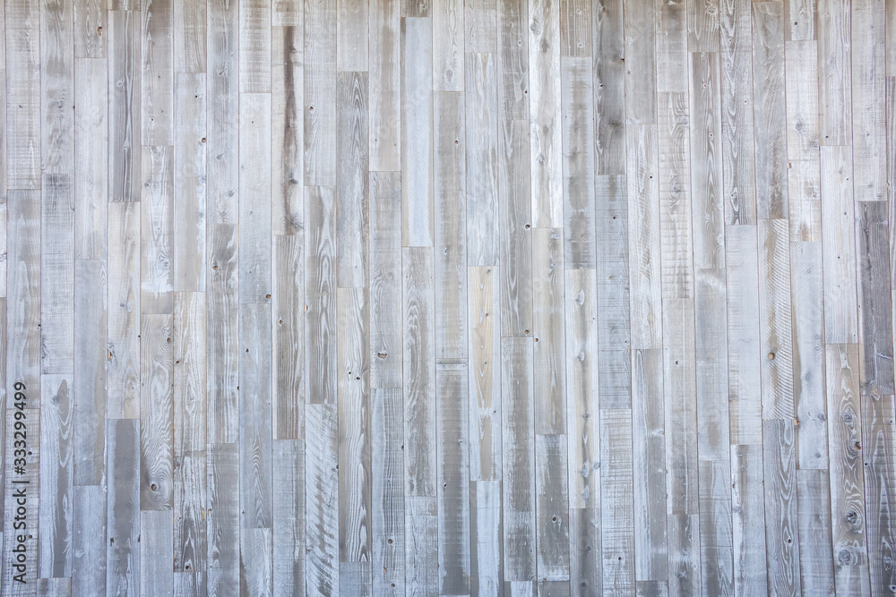 Obraz premium A wall background of rustic grey wood planks and panels