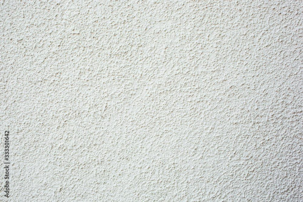 A background of pebble dash style stucco wall texture. A background of pebble dash style stucco wall texture.