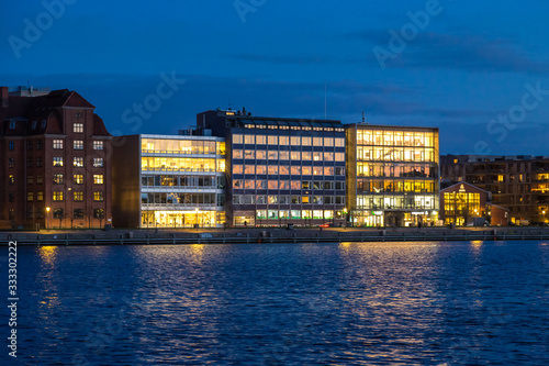 Photography old and modern buildings on Copenhagen embankment, evening view