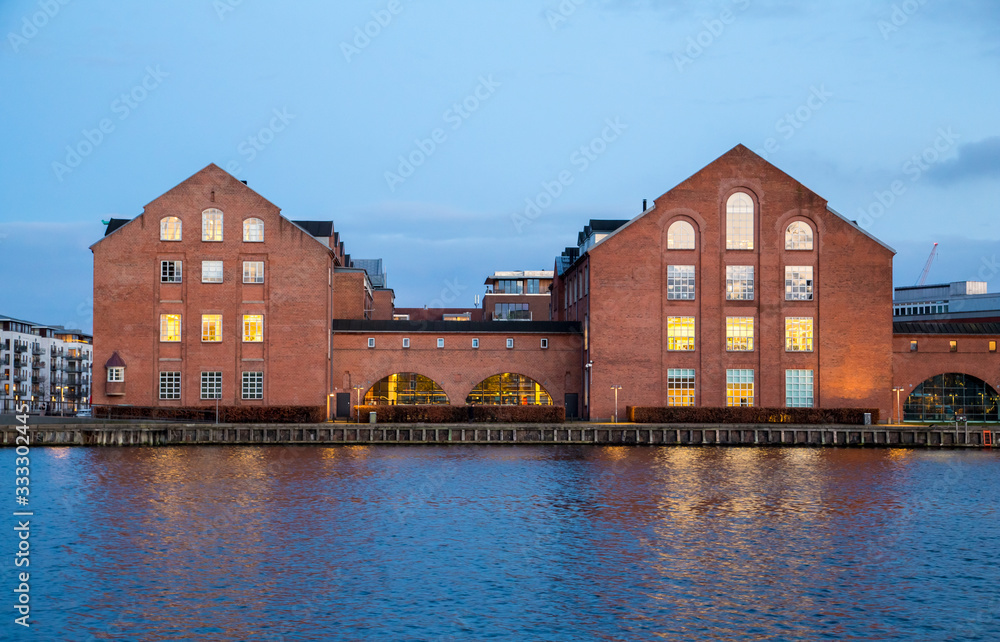 Obraz premium old buildings on Copenhagen embankment, evening view