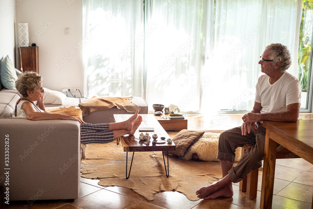 Senior couple in theri living room Senior couple in theri living room