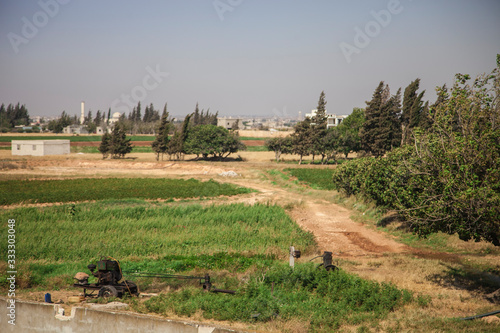 Agricultural Fields in Syrian North Village with tree and plants and houses in the back