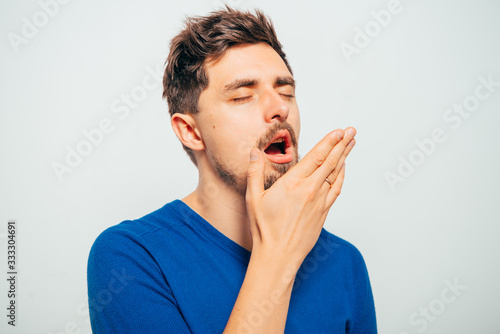 Yawns. Man